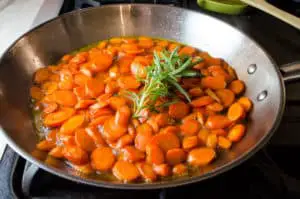 rosemary carrots cooking on the stovetop