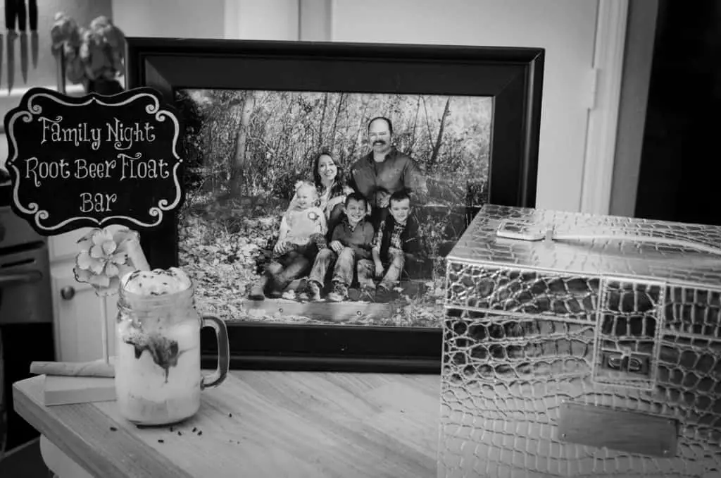 A black and white family picture sits next to a root beer float and a pretty box used as a time capsule.