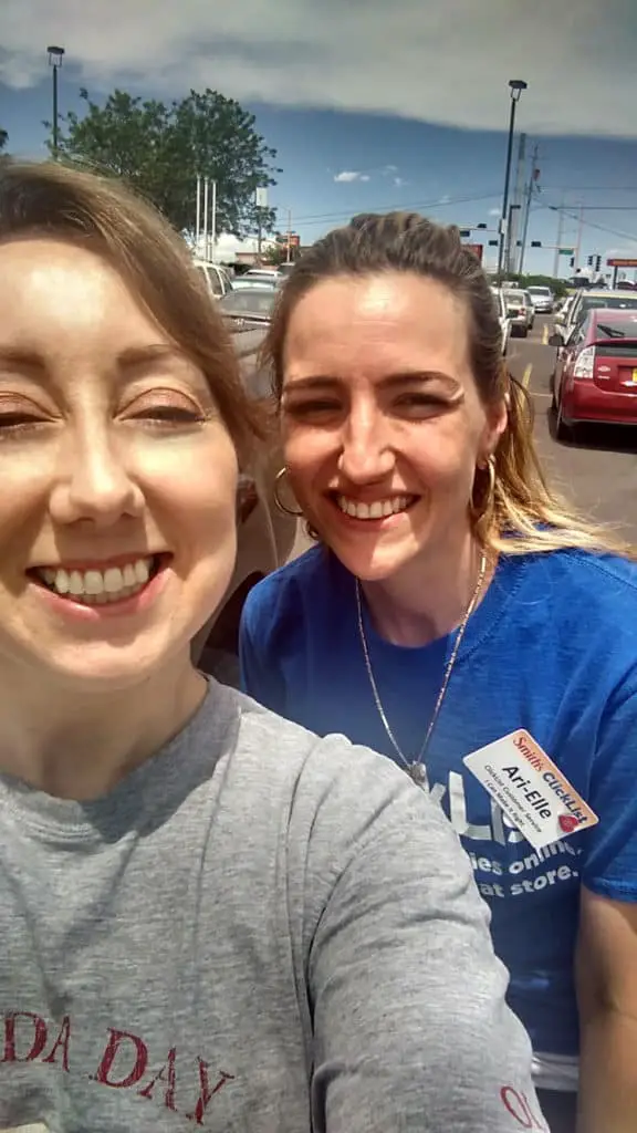 Two women pose for a selfie in a grocery store parking lot for Smith's Clicklist.