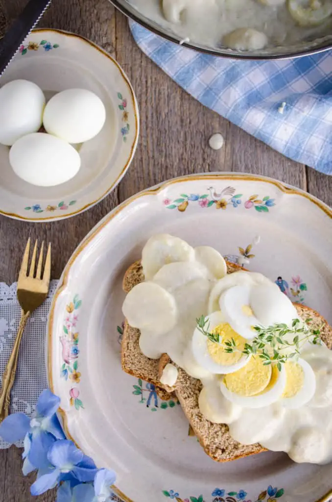 A plate full of country fresh Classic Creamed Eggs on Toast waits to be eaten.