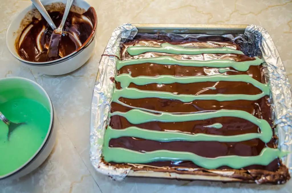 White Mint Chocolate and semisweet chocolate ganache tops Fudgy Mint Brownies.