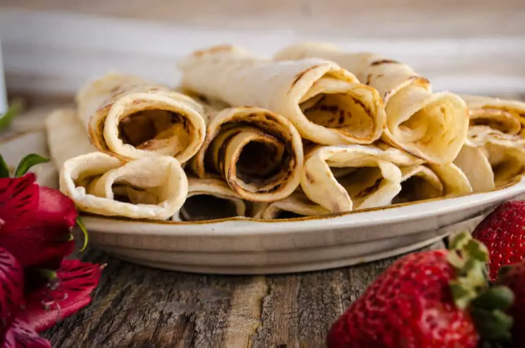 A close up of several rolled Norwegian Lefse. - The Goldilocks Kitchen