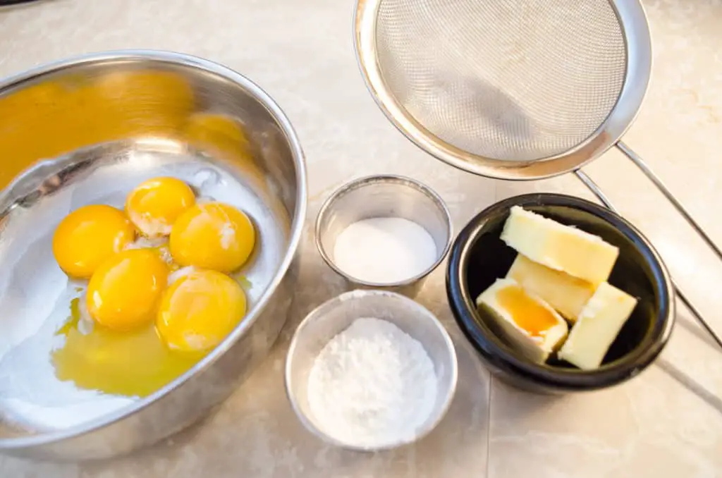 Ingredients used to make pastry cream for Fruit Tartlets include egg yolks, half and half, sugar, butter, corn starch, and vanilla - The Goldilocks Kitchen