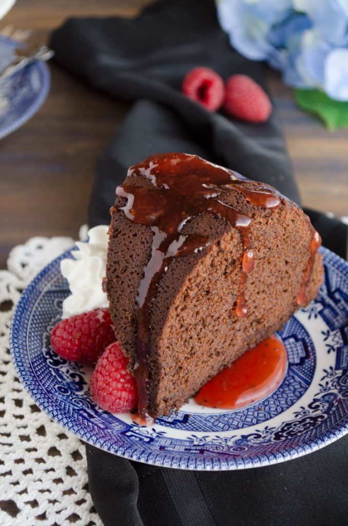 A close up of a slice of Chocolate Raspberry Bundt Cake. - The Goldilocks Kitchen