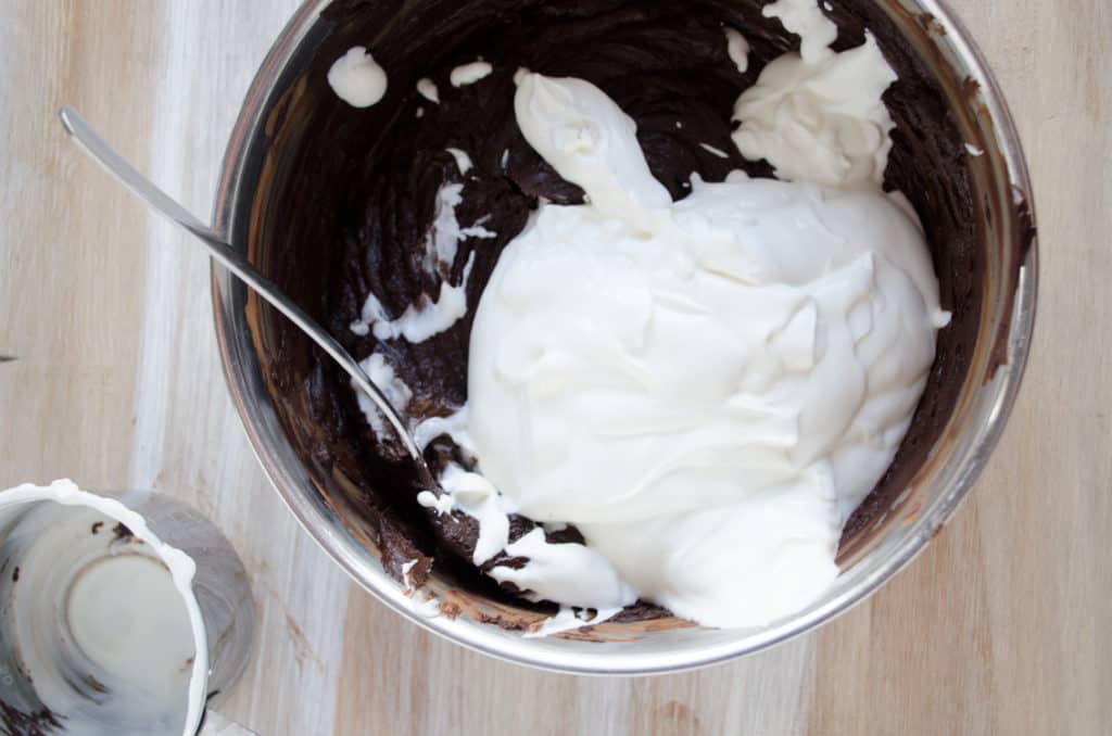 Cocoa powder, bittersweet baking chocolate and sour cream are mixed together for Chocolate Raspberry Bundt Cake. - The Goldilocks Kitchen