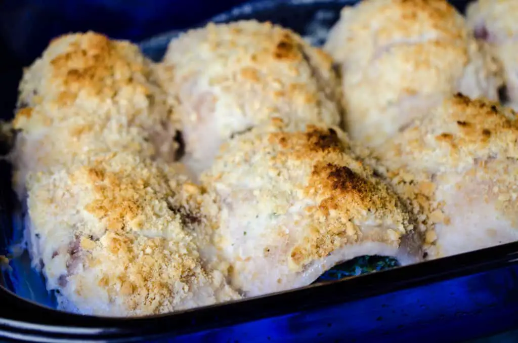A closeup of a baking dish full of Creamy Stuffed Fish Florentine fresh from the oven - The Goldilocks Kitchen