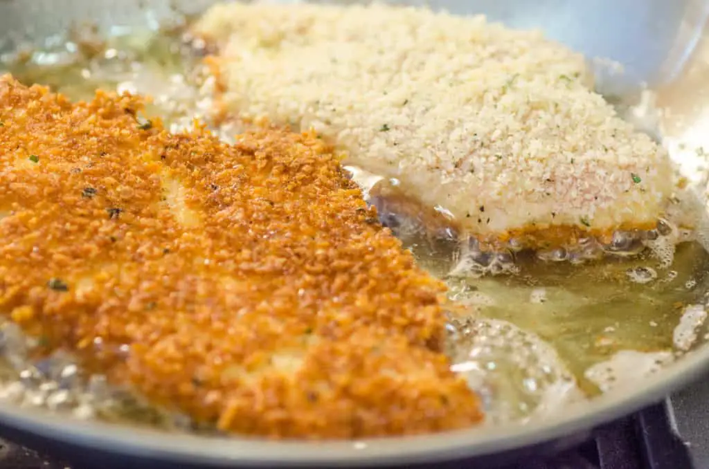 Breaded chicken cutlets are pan fried in vegetable oil until beautifully deep golden brown.