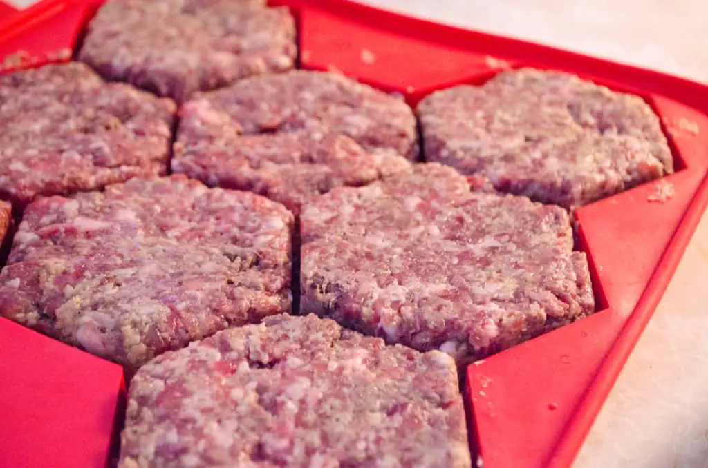 Meatloaf Burgers are pressed into a silicone burger mold.