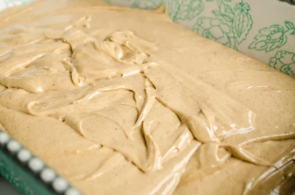 Pumpkin Spice Cheesecake Trifle cake batter in a baking pan ready for the oven - The Goldilocks Kitchen