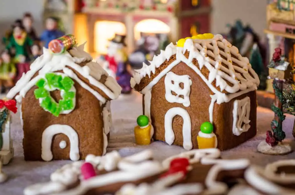 Easy Gingerbread Cookies recipe is also great for gingerbread houses. Here are two mini-houses displayed in a miniature Christmas village- The Goldilocks Kitchen