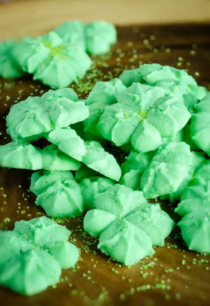 St. Patricks Day Cream Cheese Spritz Cookies are sprinkled with green candy sugar - The Goldilocks Kitchen