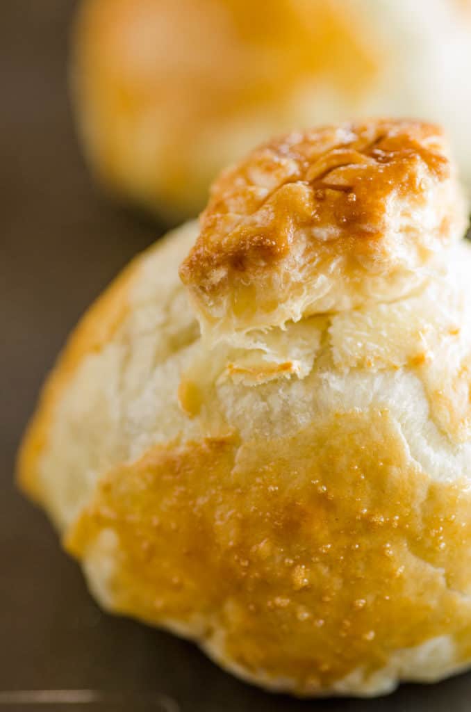 A close up picture of an Easy Meatball Wellington's golden brown exterior freshly baked from the oven. - The Goldilocks Kitchen