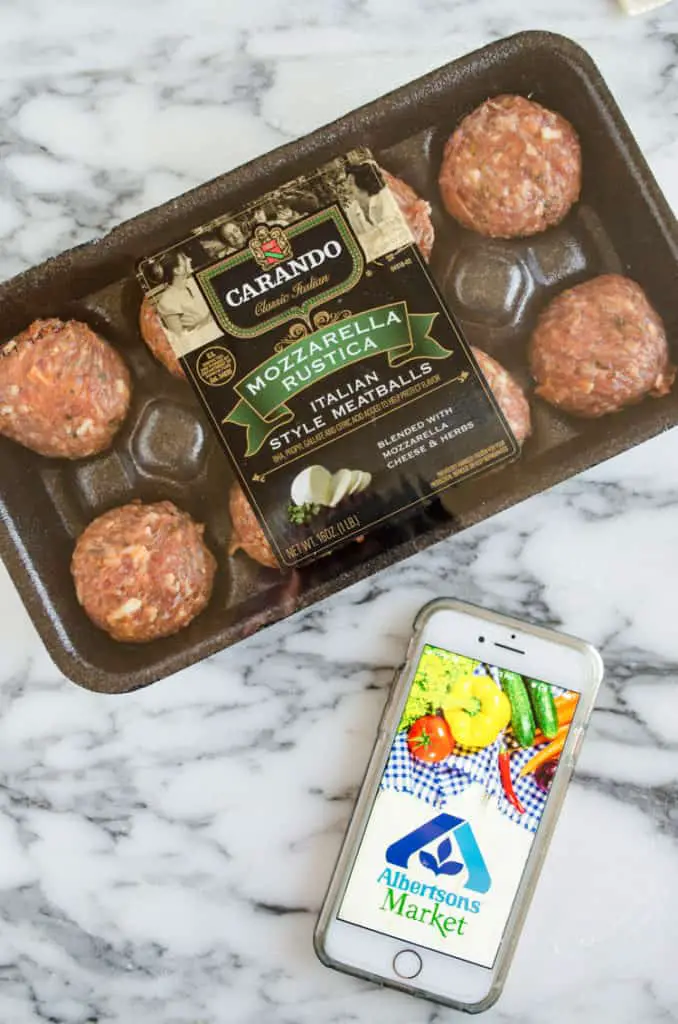 Carando brand Mozzarella Rustica Italian Style Meatballs in their packaging next to a phone with the Albertson's logo. - The Goldilocks Kitchen