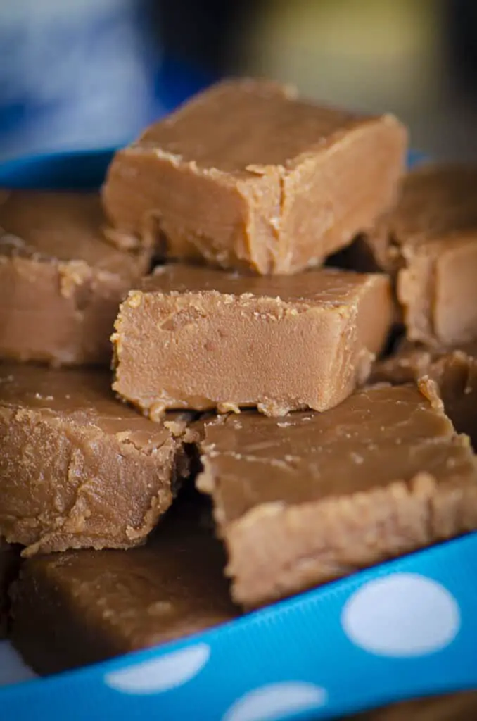 An extreme closeup of cut chocolate fudge squares to show the texture.