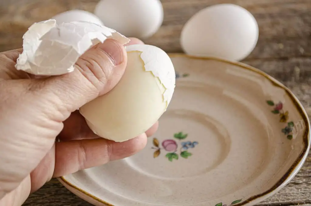 Easy-Peel Boiled eggs being peeled.